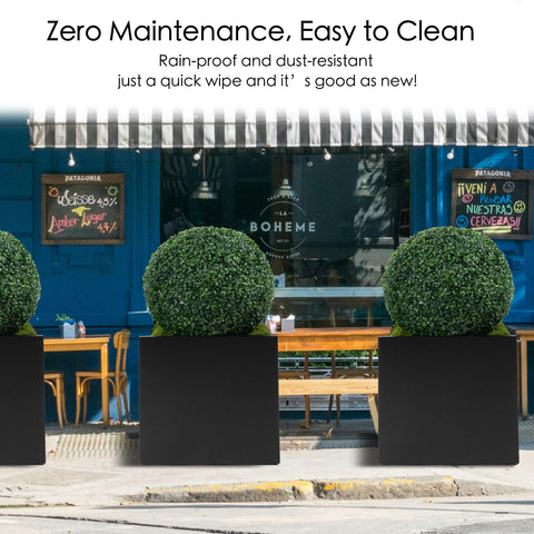 Three artificial topiary balls in black planters, positioned outside a blue storefront. These faux green spheres are rain - proof and dust - resistant, requiring zero maintenance and easy to clean with just a quick wipe.Artificial Topiary Balls - Zero Maintenance Outdoor Greenery. Artificial topiary balls, faux green plant spheres, zero maintenance, easy to clean.