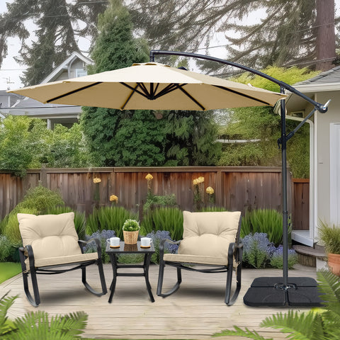 A beige cantilever patio umbrella providing shade over two cushioned outdoor chairs and a small table in a backyard setting. The umbrella is mounted on a black stand with a base, surrounded by greenery and a wooden fence. Backyard Cantilever Umbrella: Shade for Relaxing Outdoors. Outdoor Offset Umbrella: Enhance Your Patio Retreat. cantilever umbrella, patio umbrella, outdoor umbrella, backyard umbrella, patio furniture, outdoor relaxation