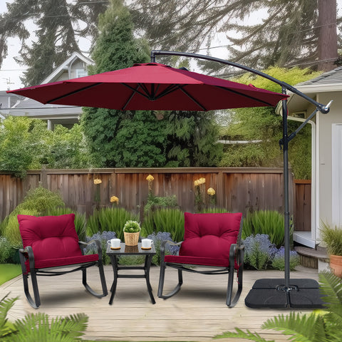A red cantilever patio umbrella providing shade over two cushioned outdoor chairs and a small table in a backyard setting. The umbrella is mounted on a black stand with a base, surrounded by greenery and a wooden fence. Backyard Cantilever Umbrella: Shade for Relaxing Outdoors. Outdoor Offset Umbrella: Enhance Your Patio Retreat. cantilever umbrella, patio umbrella, outdoor umbrella, backyard umbrella, patio furniture, outdoor relaxation