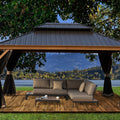 A serene outdoor aluminum gazebo with a wood - grain finish offers a tranquil retreat. The dark - hued metal roof contrasts with the wooden - look frame. Underneath, a plush sectional sofa with decorative cushions and a sleek coffee table create a cozy lounging area. Black curtains add a touch of elegance, set against a breathtaking backdrop of a lake, mountains, and lush greenery. Tranquil Outdoor Aluminum Wood - Grain Gazebo Retreat. outdoor aluminum gazebo, wood - grain finish, dark metal roof, cozy