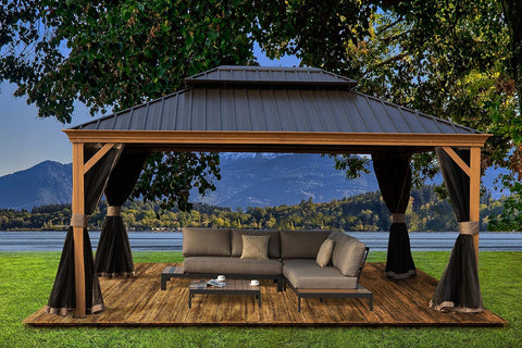 A serene outdoor aluminum gazebo with a wood - grain finish offers a tranquil retreat. The dark - hued metal roof contrasts with the wooden - look frame. Underneath, a plush sectional sofa with decorative cushions and a sleek coffee table create a cozy lounging area. Black curtains add a touch of elegance, set against a breathtaking backdrop of a lake, mountains, and lush greenery. Tranquil Outdoor Aluminum Wood - Grain Gazebo Retreat. outdoor aluminum gazebo, wood - grain finish, dark metal roof, cozy