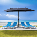 A navy blue Outdoor Patio Double - Sided Aluminum Umbrella stands on a patio area near a beach. Under the umbrella, there are three blue and white lounge chairs arranged, providing a comfortable spot for relaxation. The backdrop features a clear blue sky, the ocean, and sandy beach, highlighting the umbrella's suitability for outdoor leisure settings. Beige Outdoor Patio Double - Sided Aluminum Umbrella: Beachside Relaxation. beige outdoor umbrella, double - sided aluminum umbrella, patio umbrella, beach lo