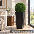 Kozyard artificial topiary ball displayed in a tall black planter for elegant modern indoor decor. Realistic dense faux boxwood foliage delivers year-round greenery without watering, trimming or maintenance, making it ideal for living rooms, offices, entryways, patios, porches and commercial spaces. Decorative artificial plant ball adds instant style to tall planters; planter is not included.