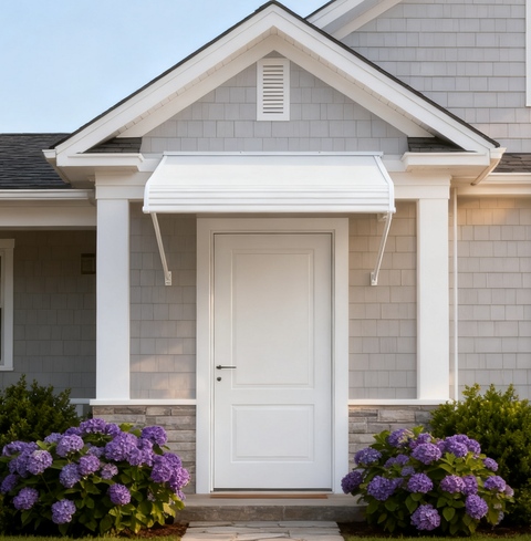 Kozyard white aluminum door awning installed above a front entrance, featuring durable PVC panels and fixed support arms, providing rain, snow, and UV protection for home exterior entryways.