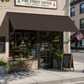 Kozyard brown metal awning installed over a coffee shop entrance, featuring a wide fixed canopy design for sun shade and rain protection. This wall mounted outdoor awning is ideal for storefronts, cafés, restaurants, windows, doors, patios and commercial entrances, combining durable powder-coated metal construction with a clean modern look for residential and commercial exterior use.