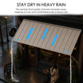 Kozyard waterproof metal awning with built-in front gutter system demonstrating rainwater drainage in heavy rain over commercial coffee shop front entrance. Durable all-weather rain canopy shield keeps patio doors, storefronts, and outdoor sitting areas completely dry and comfortable.