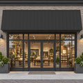 Kozyard 149 inch metal awning installed above a commercial storefront with glass double doors and large display windows, featuring a wide corrugated metal roof panel and wall mounted support brackets. This 12.4 FT outdoor canopy provides extended overhead shade and helps protect business entrances from direct sunlight and rainfall. Ideal for retail storefront awnings, cafe entrances, restaurant door canopies, boutique shops, commercial building facades, and wide exterior doorways.