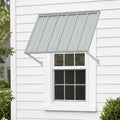 Kozyard 42 inch metal awning installed above a residential window on an exterior siding wall, featuring a corrugated metal roof panel and two adjustable support arms. This compact 3.5 FT wall mounted outdoor window canopy provides overhead shade and helps protect windows from direct sunlight and rainfall. Ideal for residential window awnings, small exterior door canopies, farmhouse windows, backyard entrances, utility room windows, and outdoor home improvement projects requiring compact weather protection.