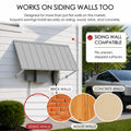 Kozyard 55 inch wall mounted metal awning designed for installation on siding, brick, wood, and concrete walls using appropriate mounting hardware. The illustrated residential installation demonstrates compatibility with uneven and stepped exterior siding surfaces. This outdoor canopy provides practical overhead coverage for utility equipment, residential windows, side entrances, garage walls, porch doors, balcony access points, and backyard areas requiring versatile wall mounting and reliable weather prote