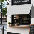 Kozyard 82 inch metal awning installed above a commercial coffee shop takeout window, featuring a durable wall mounted outdoor canopy with a corrugated metal roof panel and adjustable support arms. This 6.83 FT exterior window awning provides overhead shade and rain protection for storefront service areas and customer pickup windows. Ideal for commercial storefront awnings, restaurant takeout windows, cafe entrances, retail shop canopies, and outdoor business weather protection.