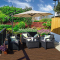 A beige cantilever patio umbrella provides shade over a black outdoor furniture set on a wooden deck. The setting is surrounded by lush greenery, colorful flowers, and a brick wall, creating a cozy outdoor relaxation spot.
Beige Patio Umbrella: Shade for a Lush Outdoor Retreat. Outdoor Offset Umbrella: Enhance Your Garden Seating Area.beige patio umbrella, outdoor umbrella, cantilever umbrella, outdoor seating area, garden shade, wicker furniture.