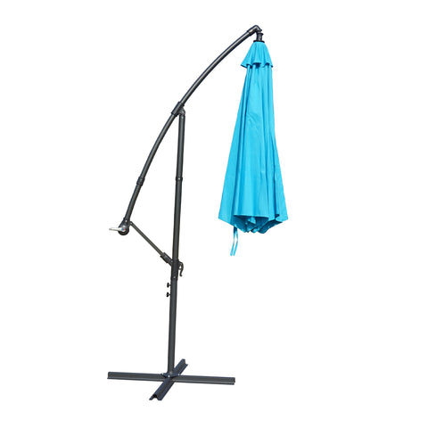 A side - view of a collapsed outdoor offset umbrella with a vibrant blue canopy, mounted on a sturdy black stand with adjustable features. Folded Blue Patio Umbrella: Compact and Sturdy Design. Collapsed Outdoor Umbrella: Blue Canopy with Adjustable Stand. blue patio umbrella, cantilever umbrella, folded umbrella, outdoor umbrella, adjustable stand, umbrella storage.
