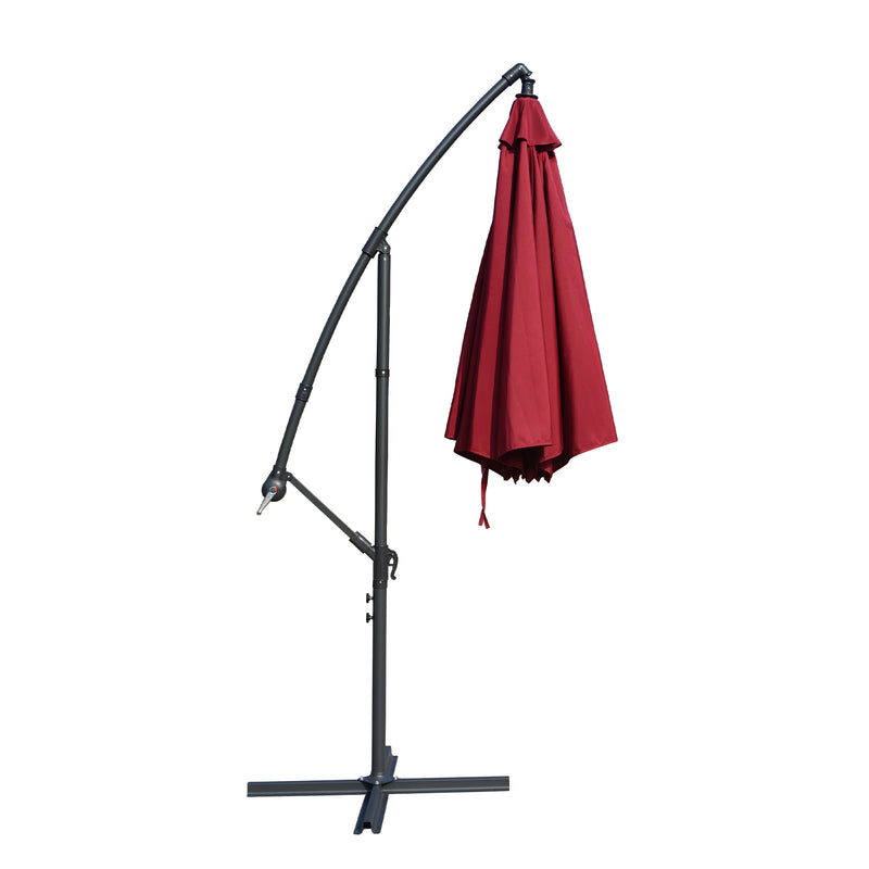 A side - view of a collapsed outdoor offset umbrella with a vibrant red canopy, mounted on a sturdy black stand with adjustable features. Folded Red Patio Umbrella: Compact and Sturdy Design. Collapsed Outdoor Umbrella: Red Canopy with Adjustable Stand. red patio umbrella, cantilever umbrella, folded umbrella, outdoor umbrella, adjustable stand, umbrella storage.