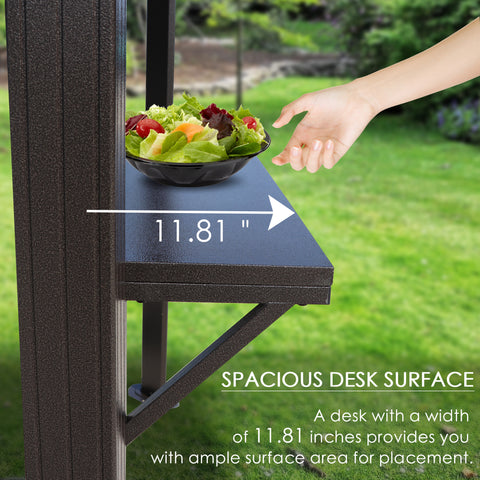 A close - up image of a dark - colored side shelf on an outdoor iron barbecue pavilion. A hand is reaching towards a bowl of salad placed on the shelf. The width of the shelf is marked as 11.81 inches, and the text below highlights that the spacious desk surface offers ample area for placing items. Spacious Side Shelf on Outdoor Iron Barbecue Pavilion. outdoor iron barbecue pavilion, side shelf, spacious desk surface, 11.81 - inch width, item placement.