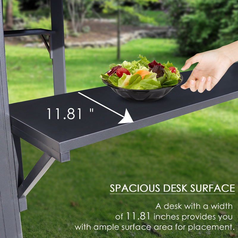 A close - up image of a dark - colored side shelf on an outdoor iron barbecue pavilion. A hand is reaching towards a bowl of salad placed on the shelf. The width of the shelf is marked as 11.81 inches, and the text below highlights that the spacious desk surface offers ample area for placing items. Spacious Side Shelf on Outdoor Iron Barbecue Pavilion. outdoor iron barbecue pavilion, side shelf, spacious desk surface, 11.81 - inch width, item placement.