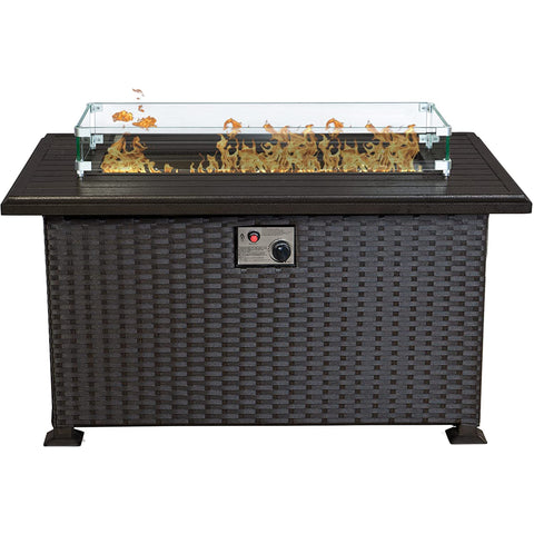 Kozyard rectangular propane fire pit table features a modern gray wicker cabinet, durable slatted aluminum tabletop, clear tempered glass wind guard and decorative fire glass surrounding the gas burner. The front-mounted ignition and adjustable flame control provide convenient operation while the enclosed base creates a clean outdoor furniture appearance. This Kozyard outdoor gas fire table is a stylish propane fire pit centerpiece for patios, decks, backyards, gardens and outdoor conversation seating areas