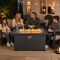 Kozyard propane fire pit table creates a cozy outdoor gathering space for family and friends, combining the warmth and ambiance of an outdoor gas fire pit with the functionality of a modern patio table. The rectangular gray wicker fire table features a spacious tabletop, clear glass wind guard, adjustable propane flame and contemporary outdoor furniture design. Ideal for backyard conversations, patio entertaining and cool evenings, this Kozyard gas fire table brings comfortable fireside seating to outdoor l