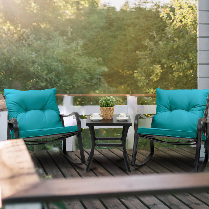 Serene Outdoor Rocking Chair Set on Wooden Deck
A tranquil outdoor rocking chair set with teal cushions, placed on a wooden deck. A small table with a plant and cups offers a cozy spot to enjoy the greenery view. Keywords: outdoor rocking chair set, wooden deck, greenery view