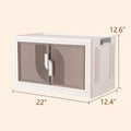 A white plastic foldable storage cabinet with semi - transparent brown doors featuring a decorative pattern. The cabinet has dimensions marked: 22 inches in length, 12.4 inches in width, and 12.6 inches in height. It also includes a handle on the side, suggesting ease of movement or folding. Compact White Plastic Foldable Storage Cabinet with Dimensions. white plastic foldable cabinet, storage cabinet with semi - transparent doors, foldable storage unit, cabinet dimensions, decorative storage cabinet