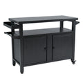 Kozyard premium extra-wide gray powder-coated metal outdoor grill cart and double-door kitchen island isolated on a white background. This professional commercial product shot showcases the modern, symmetrical design including a large flat prep tabletop, an attached side spice tray, a heavy-duty towel bar, a spacious middle shelf, a double-door storage cabinet, and smooth-rolling lockable wheels.