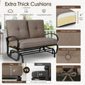 Material feature diagram showcasing the extra-thick cushions of the Kozyard outdoor glider loveseat. Detailed product breakdown highlights soft back cushions, a deep four-inch extra-thick seat cushion made of layered high-density foam, and premium fabric texture built for long-lasting comfort. Visual panels compare Kozyard's four-inch superior comfort padding against competitors' thin alternatives, while close-ups demonstrate sophisticated button tufting details and secure fabric ties.