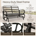 Technical specifications image highlighting the heavy-duty steel frame of the Kozyard porch glider rocker. The graphic demonstrates key structural benefits including a premium powder-coated finish for sleek all-weather protection, rust-resistant properties to withstand outdoor corrosion, and a stable reinforced construction. Three high-resolution zoom-in panels illustrate the elegant curved armrests, the integrated smooth gliding system, and the heavy-duty reinforced welding joints.
