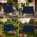 A comprehensive four-quadrant multi-scene display highlighting the versatility of the Kozyard glider bench across diverse outdoor environments. Individual quadrants feature the comfortable cushioned loveseat rocker perfectly integrated into a spacious stone patio, a covered wooden front porch, a vibrant flower garden with a woven coffee table, and an open backyard lawn setup next to a cozy fire pit. This graphic demonstrates how the all-weather glider adapts flawlessly to any exterior.