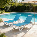 Kozyard Outdoor Poolside Chaise Lounge Set: 2 adjustable-recline lounges + matching side table, vibrant blue durable Textilene fabric & sturdy metal frame—ideal for poolside/patio relaxation with weather-resistant, outdoor-friendly build.
