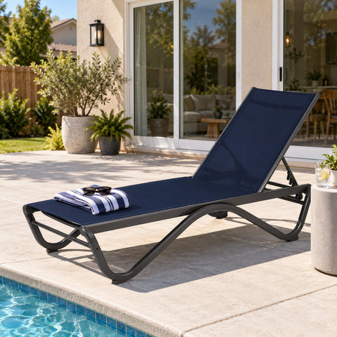 Kozyard outdoor chaise lounge chair beside a swimming pool, designed for comfortable sunbathing and relaxing outdoor living. This adjustable patio recliner features breathable mesh fabric, supportive ergonomic seating, multiple backrest positions and a durable weather-resistant frame, making it ideal as a pool lounge chair, patio sun lounger, deck chair, backyard recliner or garden lounge furniture.