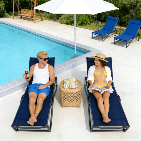 Kozyard outdoor lounge chairs in use: comfortable poolside seating for outdoor leisure, featuring weather-resistant fabric & sturdy frame for enjoyable outdoor gatherings.
