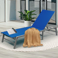 A Chic Blue Outdoor Lounge Chair by Pool
alt text：A stylish blue outdoor lounge chair, placed by a pool and accessorized with a magazine, drinks, and a throw blanket. Keywords: blue outdoor lounge chair, poolside, patio furniture.
