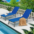 Charming Blue Poolside Lounge Chairs
alt text：Two blue lounge chairs by the pool, accessorized with a magazine and a throw blanket, set against a backdrop of greenery and a white picket fence. Keywords: blue lounge chairs, poolside, outdoor relaxation
