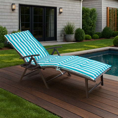 A foldable lounge chair with striking blue and white striped cushions is placed beside a pool, overlooking the sea. The chair comes with a convenient side cup - holder, perfect for relaxing by the water.Foldable Lounge Chair with Blue - White Striped Cushions by the Poolside. foldable lounge chair, blue and white striped cushions, poolside chair, side cup - holder, seaside relaxation.