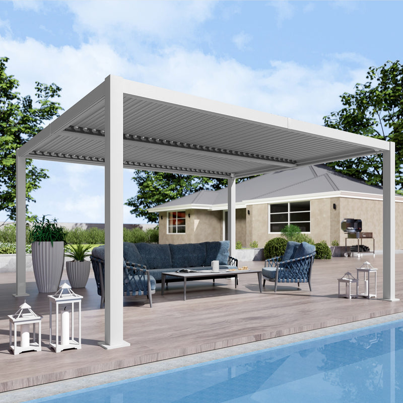 A modern white louvered pergola offers shade over a stylish outdoor lounge area by a pool. The space features a dark blue sofa set, a coffee table, decorative lanterns, and potted plants, creating a serene and inviting outdoor living environment. White Louvered Pergola for Poolside Lounge. louvered pergola, poolside, outdoor lounge, white pergola, outdoor living.