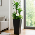 Kozyard tall indoor outdoor planter brings modern style to houseplants, flowers, ferns and decorative greenery. Featuring a sleek tapered metal design, this large floor planter is ideal for living rooms, entryways, offices, patios, porches, balconies and other residential or commercial spaces, providing an attractive plant container for tall plants and mixed botanical arrangements.