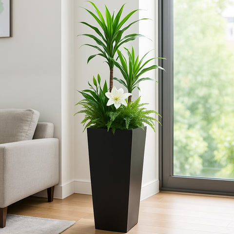 Kozyard tall indoor outdoor planter brings modern style to houseplants, flowers, ferns and decorative greenery. Featuring a sleek tapered metal design, this large floor planter is ideal for living rooms, entryways, offices, patios, porches, balconies and other residential or commercial spaces, providing an attractive plant container for tall plants and mixed botanical arrangements.