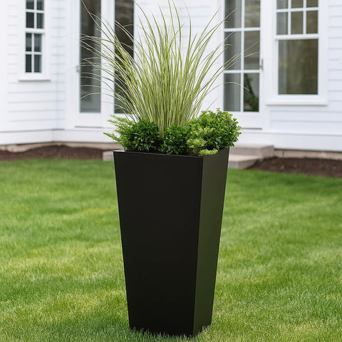 Kozyard tall outdoor planter provides a modern landscaping solution for ornamental grasses, shrubs, flowers and decorative greenery. The large tapered metal planter creates vertical visual interest for front yards, patios, porches, decks, entryways, gardens and walkways, combining generous planting space with a contemporary profile for residential and commercial outdoor plant displays.