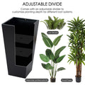 A tall, black metal taper planter with an adjustable divider, demonstrating its versatility for different plants such as low shrubs, medium - sized potted plants, and small trees. Ideal for customizing planting depth according to root systems. Tall Taper Black Metal Planter with Adjustable Divider. Tall taper planter, black metal, adjustable divider, indoor - outdoor planters