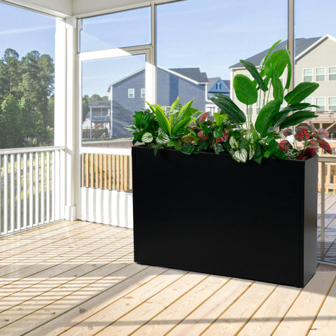 A black metal rectangular planter box filled with vibrant green plants, placed on a wooden - floored screened porch. The sturdy steel construction is ideal for enhancing outdoor living spaces with greenery. Black Metal Rectangular Planter Box for Porch Decor. Metal planter box, rectangular, steel, porch decor, outdoor plants.