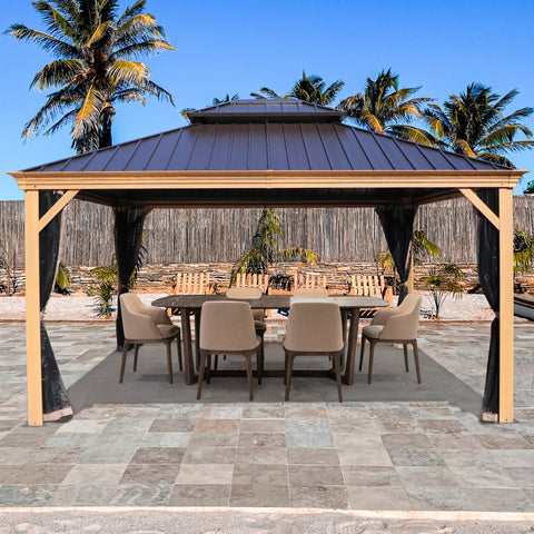 An outdoor aluminum gazebo with a wood - grain finish, featuring a dark - colored metal roof. Set in a patio area with tiled flooring, it provides shade over a dining setup that includes a round table and cushioned chairs. Black curtains hang from the sides, and the background includes palm trees and a wooden fence, creating a tropical and inviting outdoor space. Inviting Outdoor Aluminum Wood - Grain Gazebo for Dining. outdoor aluminum gazebo, wood -grain finish, dark metal roof, dining area, black curtain
