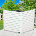 A white outdoor privacy fence with horizontal slats, used to conceal trash cans. The fence is set against a backdrop of greenery and a clear blue sky, placed on a pebble - like hard surface. White Outdoor Fence for Trash Can Concealment. outdoor fence, white fence, privacy fence, trash can cover, yard decor