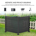 A 47 - inch tall outdoor privacy fence in dark color with wide slatted panels. It is used to conceal items like trash cans, air conditioning units, leaf piles, and garden tools, helping to keep the yard looking clean and tidy. The background shows a suburban setting with greenery and houses.Functional Outdoor Privacy Fence for Yard Cleanliness. outdoor privacy fence, yard organization, trash can cover, air conditioner enclosure, garden tool storage.