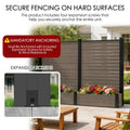 Space-saving garden integration with the Kozyard all-in-one privacy screen and raised planter box. This composite WPC fence features an integrated watering design where a woman is watering hydrangeas. No extra pots are needed. The vertical screen includes hanging hooks for herbs, small plants, or decorative items. Perfect for compact patios, balconies, or outdoor room dividers, combining aesthetics and utility.