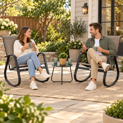 Kozyard outdoor rocking chair with white aluminum frame and beige breathable Textilene seat shown in a modern backyard patio setting. Comfortable high-back patio rocker offers smooth rocking motion, weather-resistant outdoor durability and lightweight construction, creating relaxing seating for porch, deck, balcony, garden, backyard and poolside outdoor living spaces.