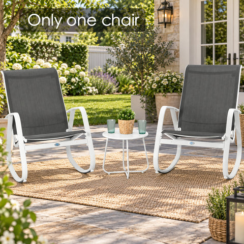 Kozyard outdoor rocking chair shown in a stylish garden patio setting with white aluminum frame, gray Textilene fabric and modern curved rocker base. This weather-resistant patio rocking chair is ideal for porch, backyard, balcony, deck, garden and poolside relaxation, offering breathable seating, lightweight construction and comfortable outdoor lounge furniture style.