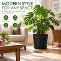 Kozyard modern black planter with matching saucer brings a clean contemporary look to living rooms, patios, entryways, offices and other indoor outdoor spaces. Shown with a large Monstera plant, this stylish textured plant pot is ideal for medium to large houseplants, tropical plants, flowers and greenery, combining decorative modern home styling with versatile placement throughout the home and garden.
