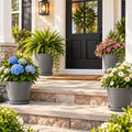 Kozyard large outdoor planters with matching saucers display hydrangeas, coneflowers, daisies, mums and ferns on a sunny front porch. These modern flower pots provide stylish containers for medium to large plants and seasonal flowers, making them ideal outdoor planters for porch, patio, garden, entryway, deck and landscaping decor while adding a clean contemporary look.