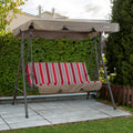 A Kozyard outdoor swing chair situated on a paved patio area, surrounded by lush greenery. The swing features a sturdy metal frame and a canopy in a muted brown color. The seat is adorned with a cushion that has a vibrant pattern of red, grey, and white vertical stripes, adding a pop of color to the outdoor setting. Kozyard Outdoor Swing Chair: Relax in Style in Your Garden. Kozyard swing chair, outdoor patio swing, striped - cushion swing, swing with canopy, garden swing chair.