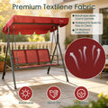 kozyard 3-seat patio swing chair in use, comfortable outdoor conversation swing with canopy for backyard relaxation
