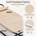 Soft padded fabric outdoor hammock close up, durable Oxford fabric wear resistant patio lounge cot, thick padded cotton soft breathable cozy swing bed cushion material details, easy to clean waterproof water droplets outdoor furniture textile.